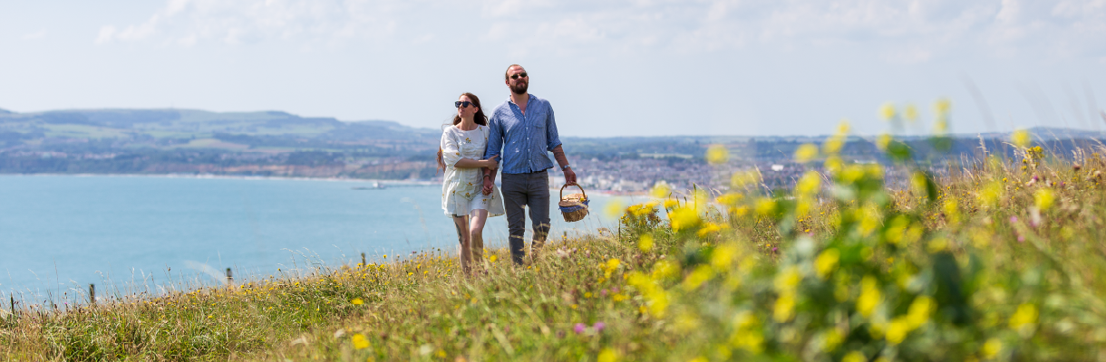 Couple walking along Culver Down on the Isle of Wight